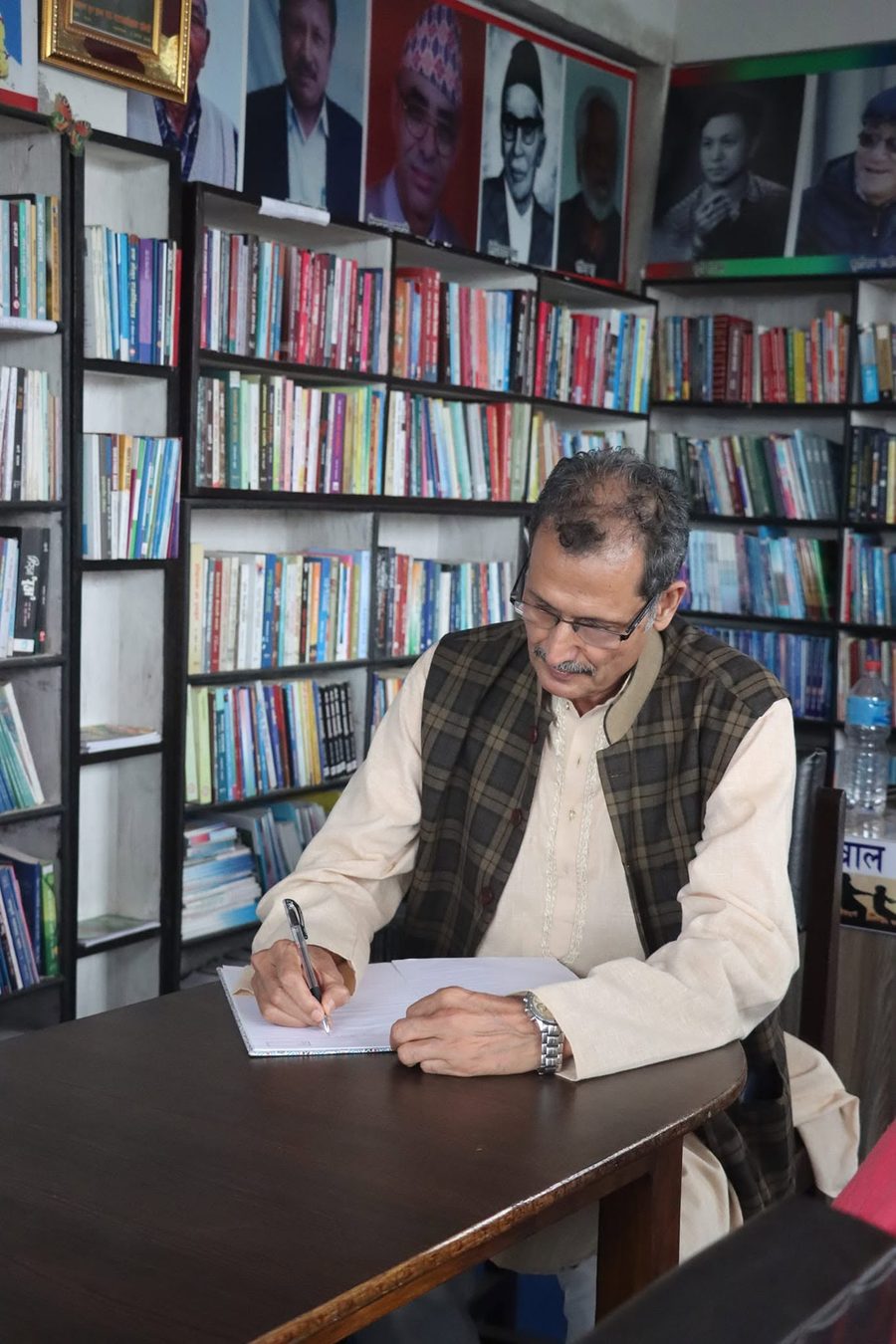 A visitor signing KMRDL's guest book