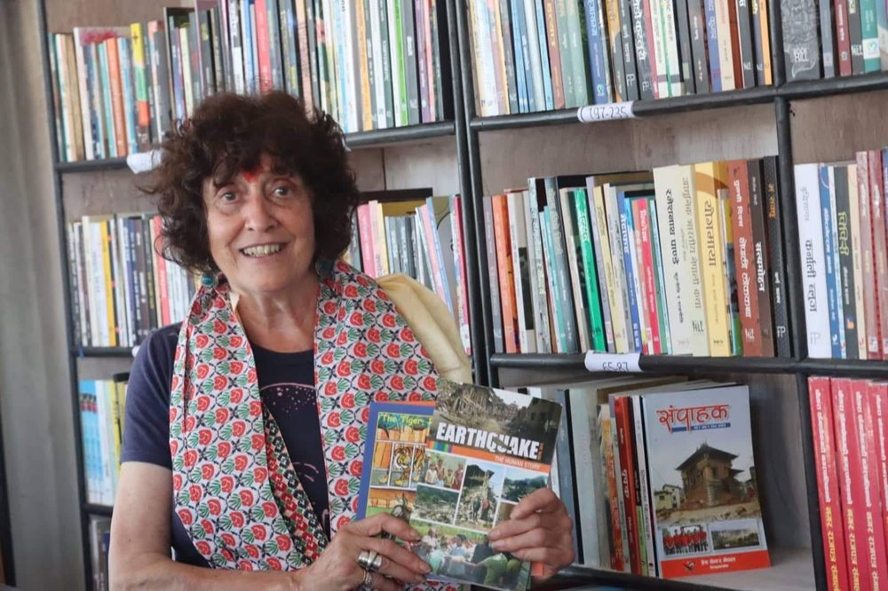 A visitor browsing children's and educational titles at KMRDL